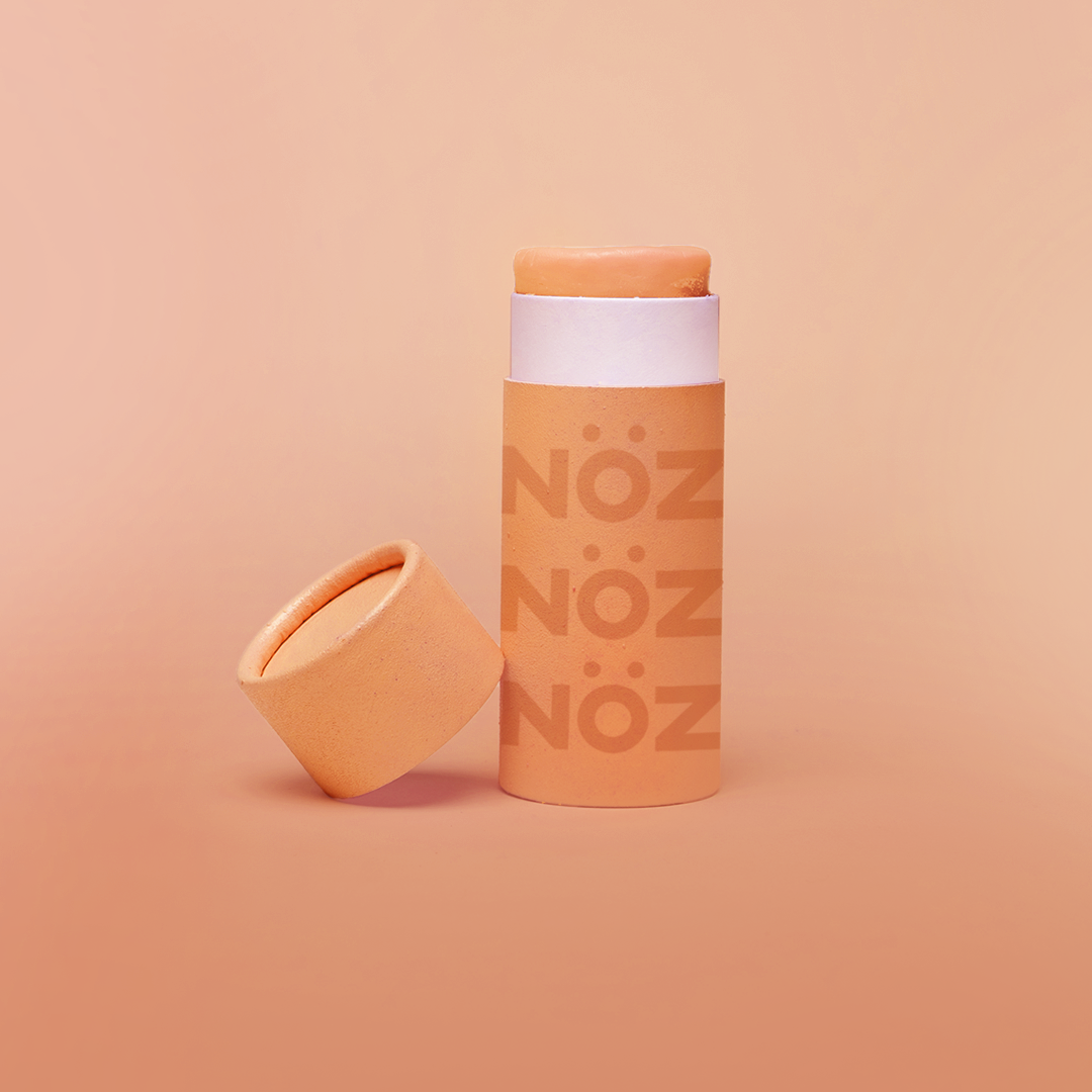 Nӧz sunscreen stick in citrus orange.