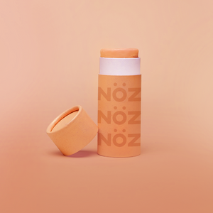 Nӧz sunscreen stick in citrus orange.